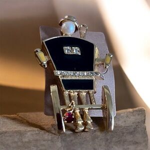 Elegant Gold and Black Carriage Brooch